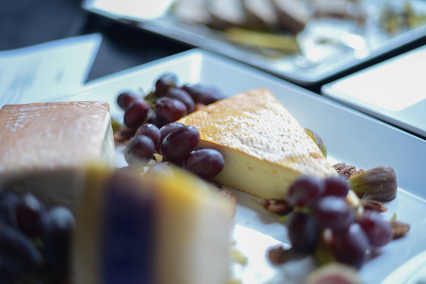 Artisanal Cheese Platter with Grapes and Nuts