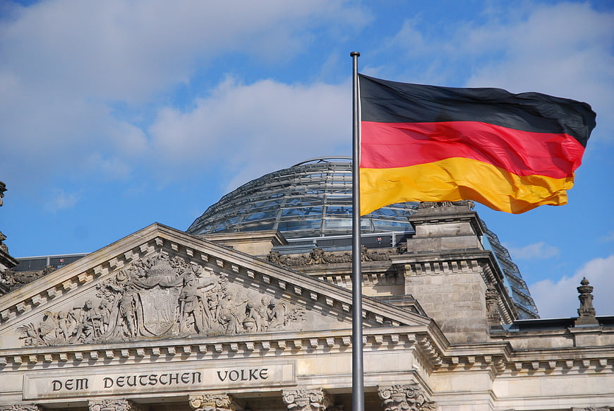 German Flag Waving in Front of the Reichstag Building in Berlin