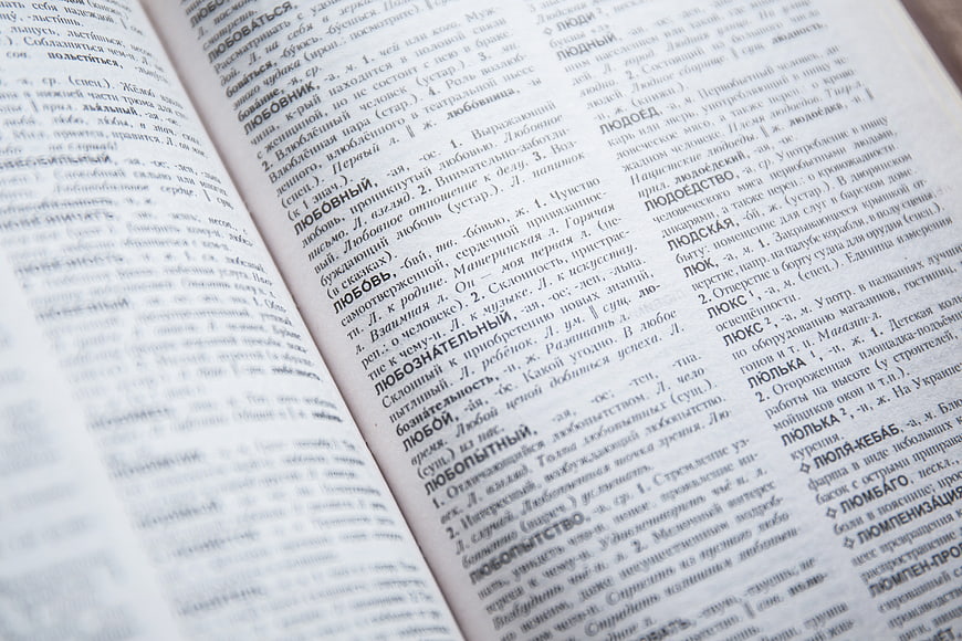 Close-up of open Russian dictionary page with text