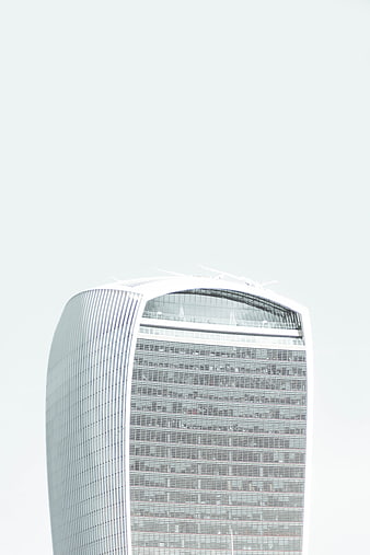 Modern Skyscraper Top Against White Sky