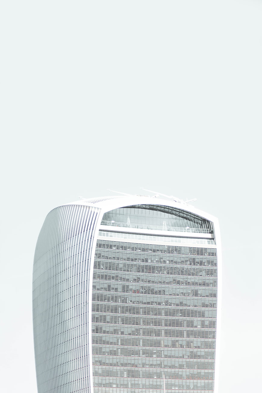 Modern Skyscraper Top Against White Sky