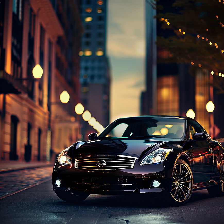 Sleek Black Luxury Car on City Street at Dusk