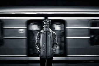 Man Standing in Front of Moving Train