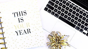 New Year Planner and Laptop Workspace with Gold Bow