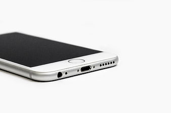 Close-up of white smartphone bottom edge with charging port