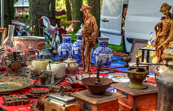 Vintage antiques and ceramics at an outdoor flea market