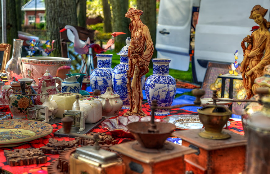Vintage antiques and ceramics at an outdoor flea market