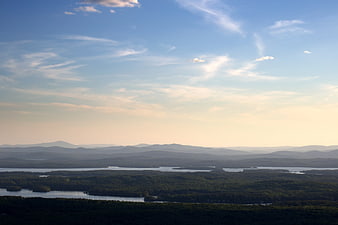 Scenic Lake and Mountain Landscape with Blue Sky