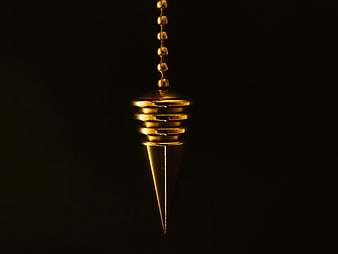 Hanging Gold Plumb Bob Pendant on Black Background