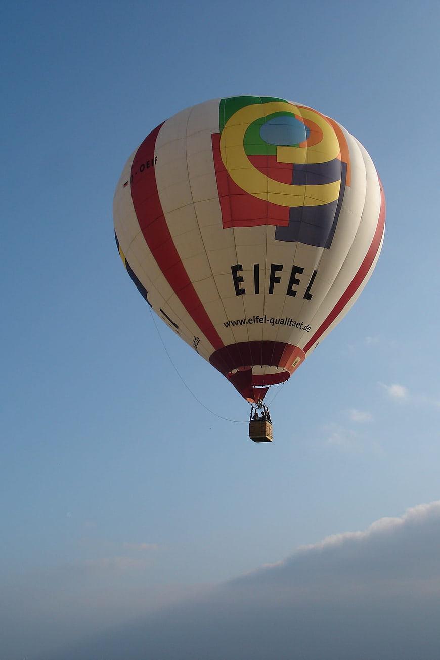 Colorful Hot Air Balloon Flying in Blue Sky