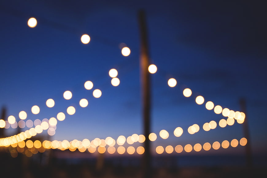Bokeh String Lights Against Blue Twilight Sky