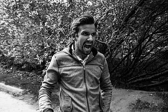 Angry Man Screaming Outdoors in Black and White