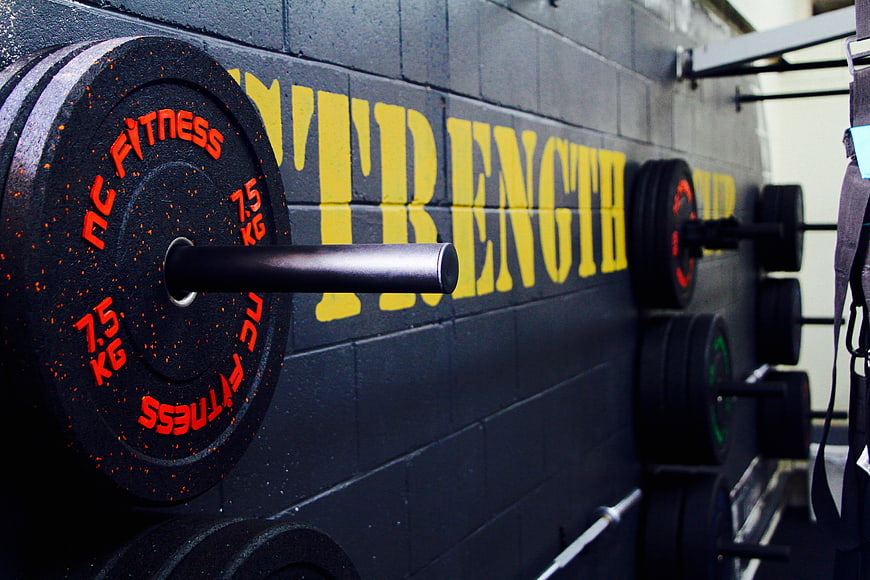Close-up of gym weights and strength wall mural