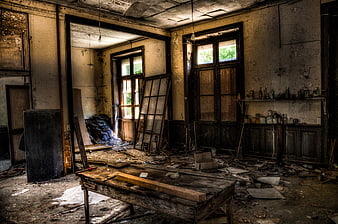Abandoned Dilapidated Interior Room with Debris and Peeling Walls