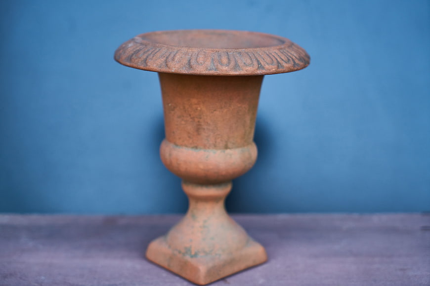 Vintage Terracotta Candlestick Holder on Blue Background