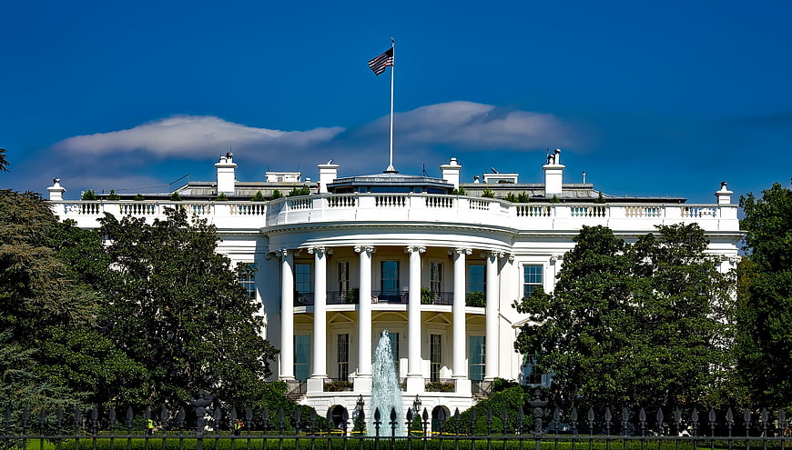 White House exterior with fountain and American flag