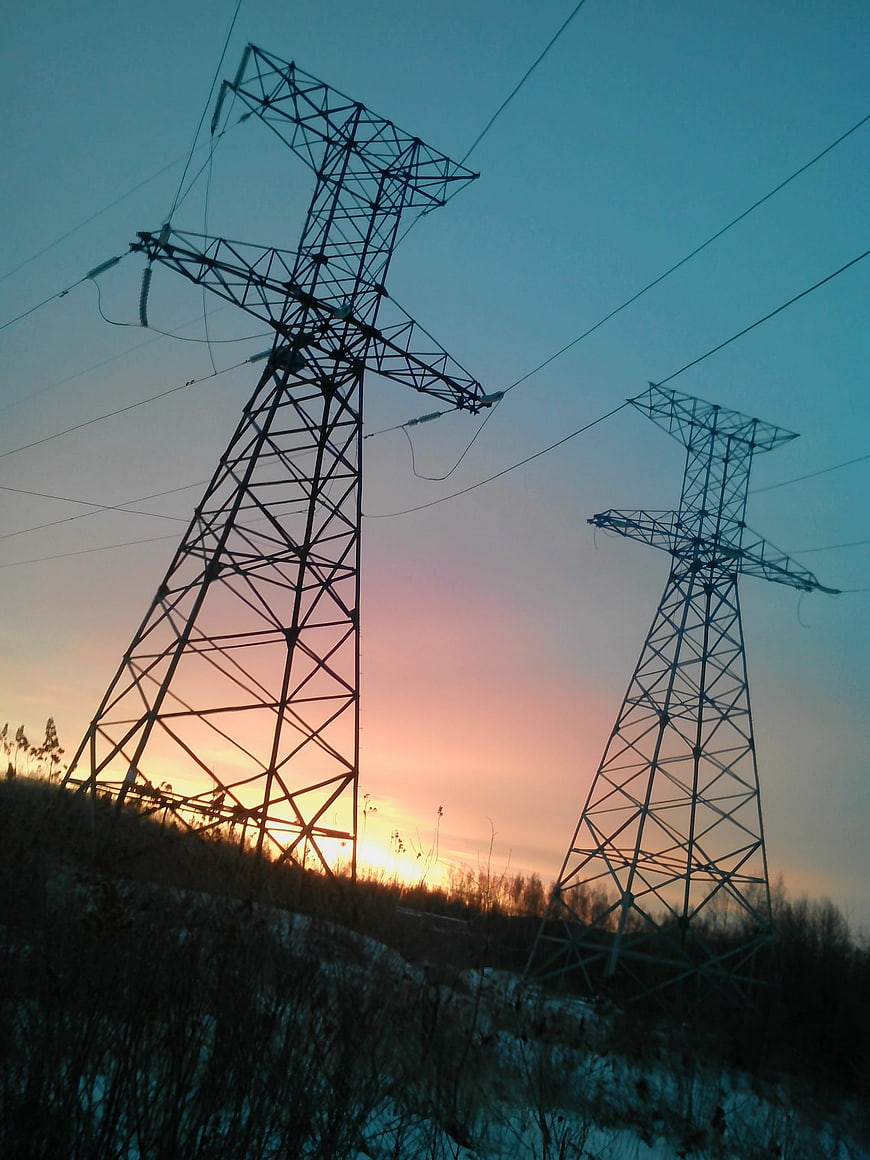Silhouette of High Voltage Power Lines at Sunset