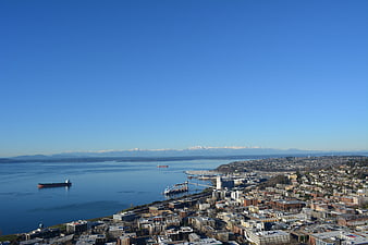 Aerial View of Seattle Cityscape with Mountains and Water