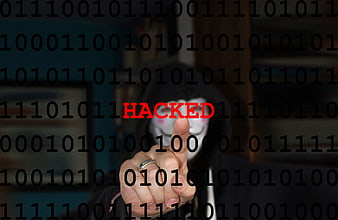 Hacker in Hoodie Pointing at Hacked Text Overlay