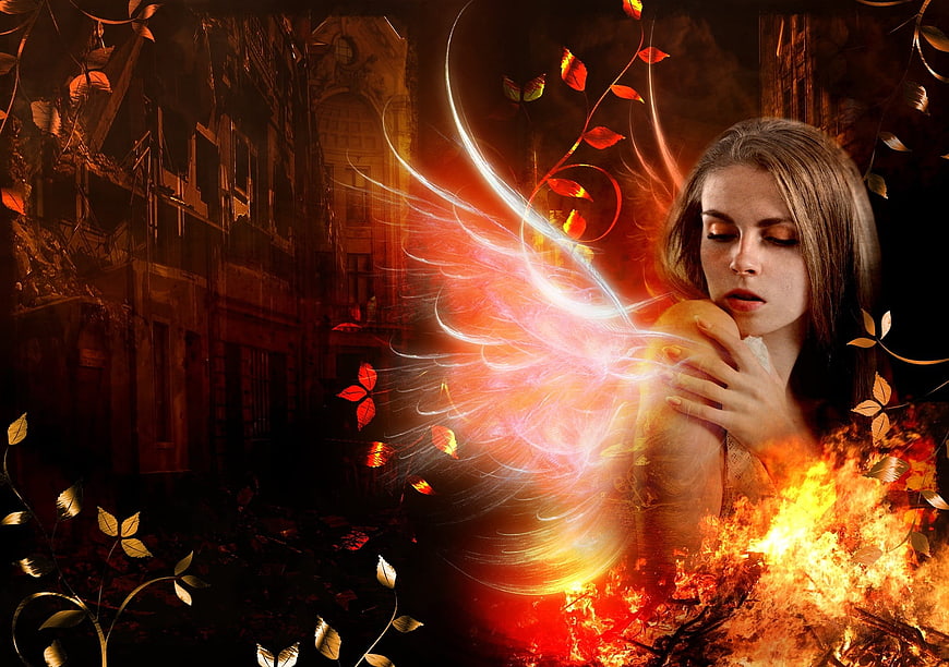 Fantasy woman with glowing fire wings and autumn leaves
