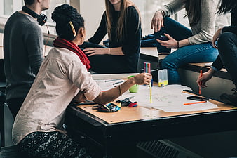 Diverse group of students brainstorming and studying together