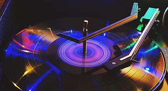 Spinning Vinyl Record Player with Neon Blue and Orange Lighting