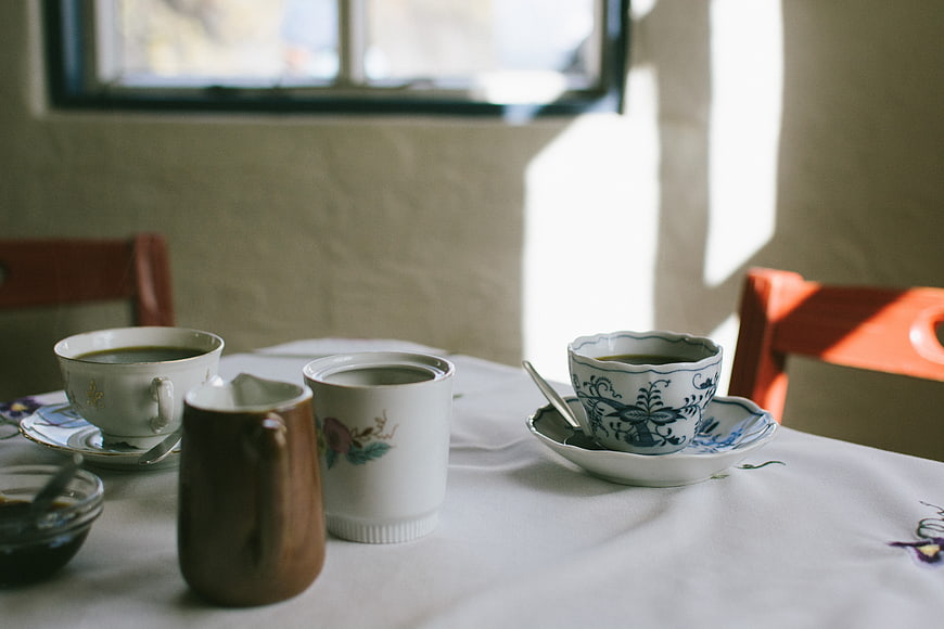 Vintage Tea Cups on Table with Sunlight