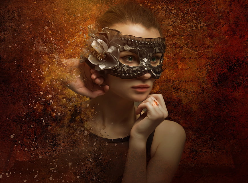 Young woman wearing ornate masquerade mask with floral detail