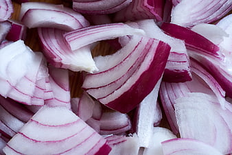 Close-up of sliced red onions on wooden surface