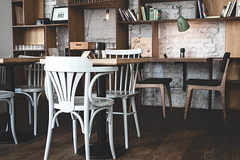 Modern Hip Bistro Interior with Wooden Furniture and White Brick