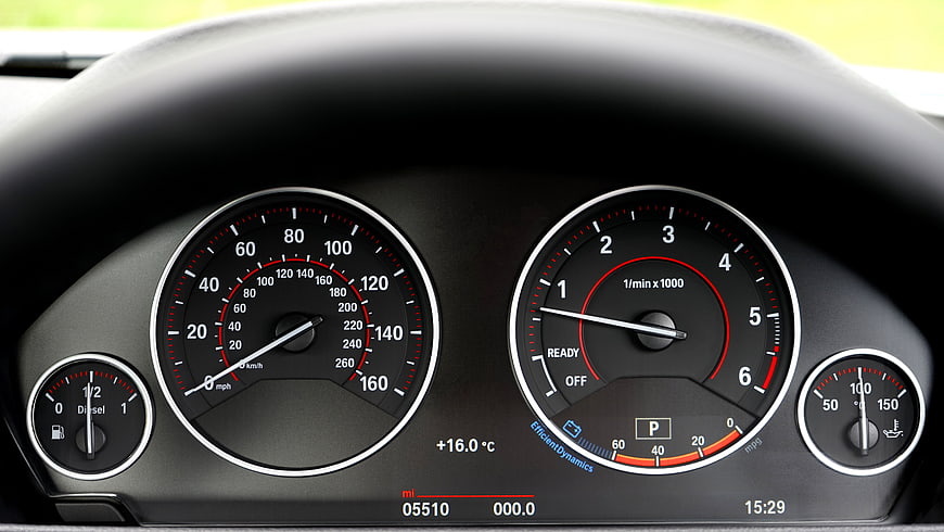 Car Dashboard Instrument Cluster with Speedometer and Tachometer