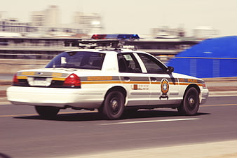 Police car speeding on highway with motion blur