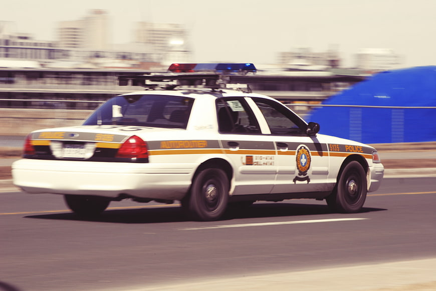 Police car speeding on highway with motion blur