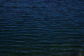 Dark Blue Ocean Water Surface with Gentle Ripples