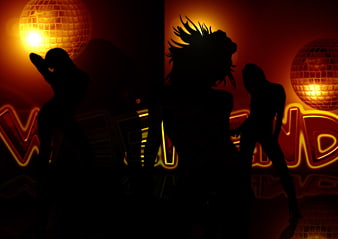 Silhouetted Dancers in Neon-Lit Disco Club