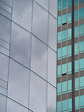 Modern Glass Building Facade with Geometric Patterns