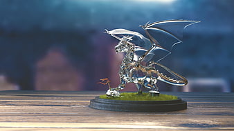 Glass Dragon Sculpture On Wooden Table