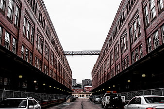 Symmetrical View of Red Brick Industrial Buildings with Skybridge