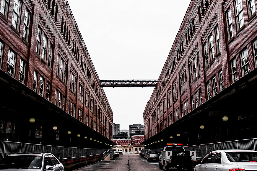 Symmetrical View of Red Brick Industrial Buildings with Skybridge