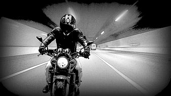 Motorcyclist Riding Through Tunnel in Black and White