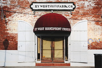 Key West Handprint Fashions storefront with red awning