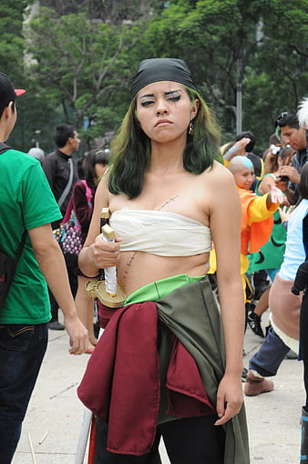 Young woman in zombie cosplay costume at outdoor street festival
