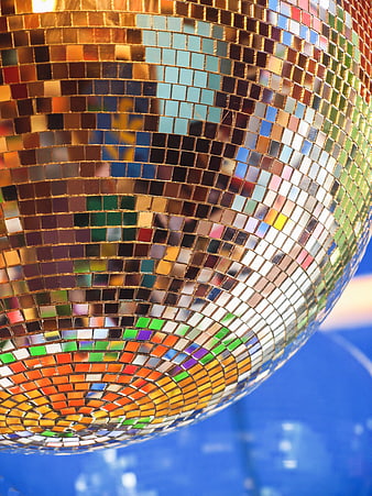 Close-up of a colorful disco ball with mirrored tiles