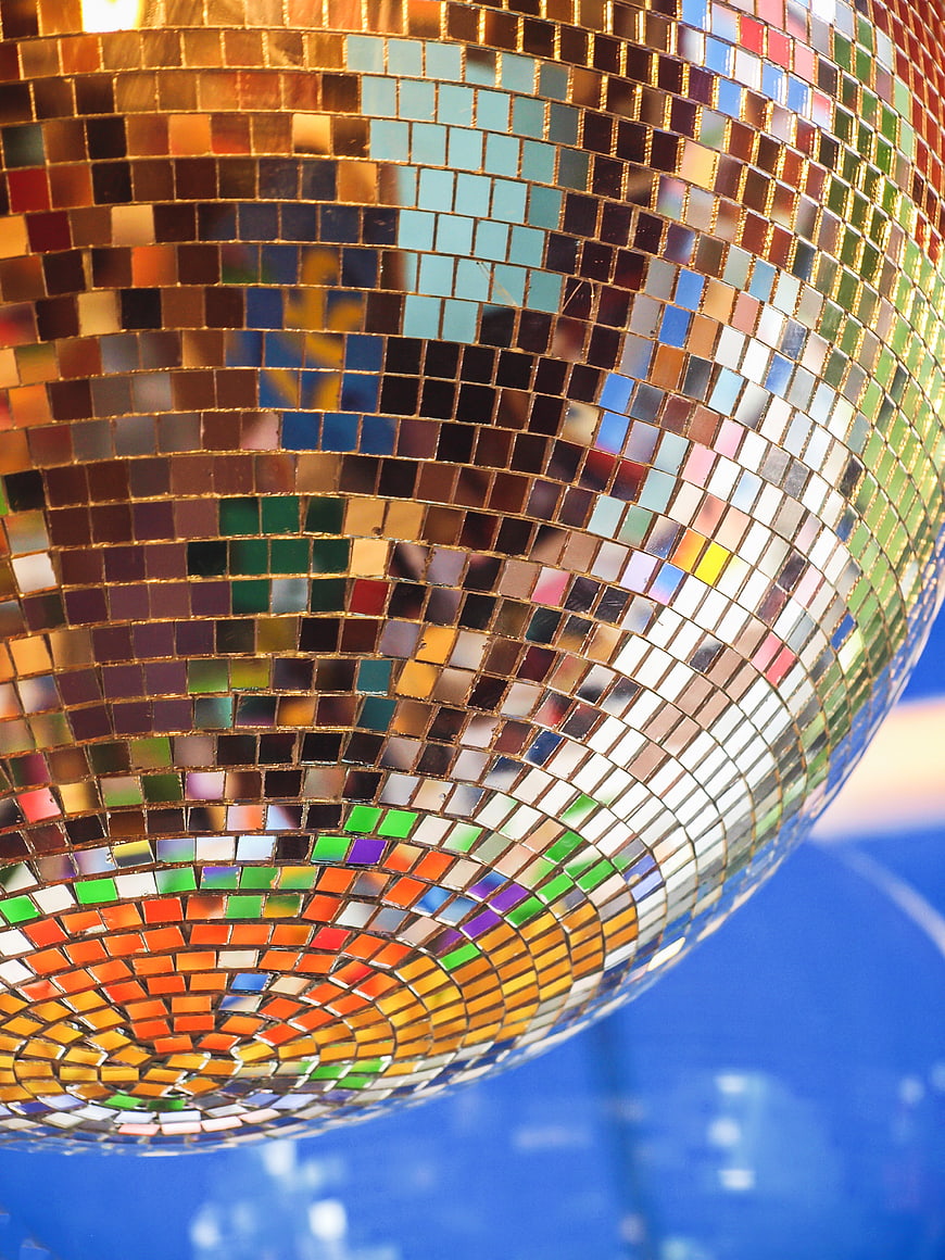 Close-up of a colorful disco ball with mirrored tiles