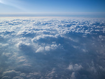 Aerial View of Endless Cloud Sea Under Blue Sky