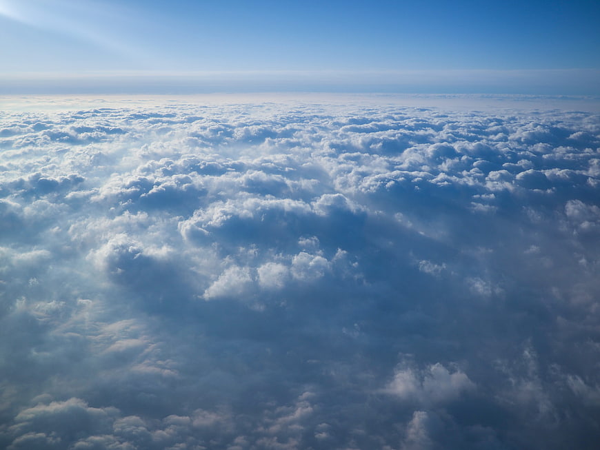 Aerial View of Endless Cloud Sea Under Blue Sky