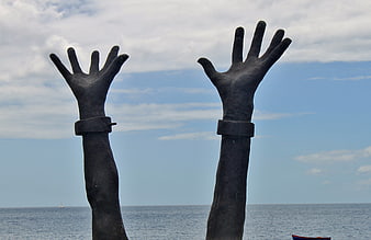 Monument of Hands Reaching for Freedom by the Sea
