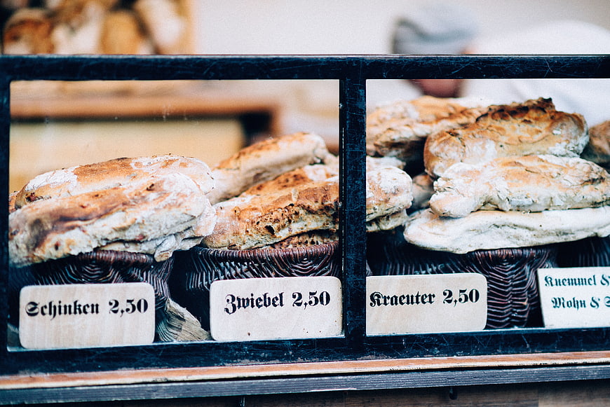 Artisanal German bread loaves in bakery display case