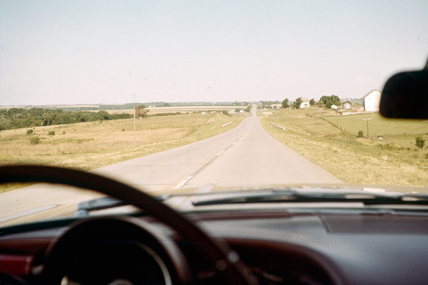 Vintage View of Rural Highway from Car Dashboard