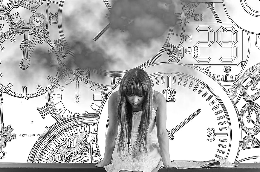 Sad young woman sitting with clocks and dark clouds background